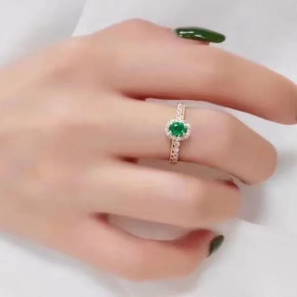 natural emerald ring, marquise-cut, halo design, 925 sterling silver with a lustrous white gold finish - detail close up
